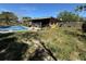 The home features an exterior view of the home and yard with a pool at 460 W Pierce St, Lake Alfred, FL 33850