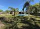 The house features a covered pool and patio area with a large backyard at 460 W Pierce St, Lake Alfred, FL 33850