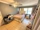 A cozy primary bedroom features natural lighting with tile flooring at 460 W Pierce St, Lake Alfred, FL 33850