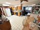 Spacious eat-in kitchen with tile floors, natural wood cabinets and a dining area at 460 W Pierce St, Lake Alfred, FL 33850