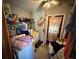 Functional laundry area featuring a washer, dryer, shelving, and ample storage options at 460 W Pierce St, Lake Alfred, FL 33850