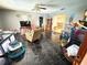 Spacious living room with dark tile flooring and neutral walls at 460 W Pierce St, Lake Alfred, FL 33850