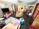 Large living room with dark tile floors, ceiling fan, and plenty of natural light at 460 W Pierce St, Lake Alfred, FL 33850