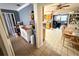 A bright living space with tile flooring leading to open kitchen with wood cabinets at 460 W Pierce St, Lake Alfred, FL 33850