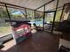 Enclosed patio leading to backyard with pool, offering seamless indoor/outdoor living at 460 W Pierce St, Lake Alfred, FL 33850
