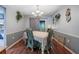 The dining room features wood-look floors, gray walls, and a stylish chandelier at 530 Heather Ct, Bartow, FL 33830