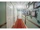 Inviting hallway with decorative wall art leads into the home's living spaces at 530 Heather Ct, Bartow, FL 33830