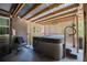 Enclosed back patio features a hot tub with a corrugated metal roof and decorative lattice walls at 530 Heather Ct, Bartow, FL 33830