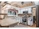 Well-maintained kitchen with white cabinetry, modern appliances, and decorative lighting at 530 Heather Ct, Bartow, FL 33830