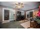 Living room featuring sliding glass doors for indoor/outdoor living and a ceiling fan for year-round comfort at 530 Heather Ct, Bartow, FL 33830