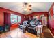 Relax in this living room featuring reclining leather seats and bay window at 530 Heather Ct, Bartow, FL 33830