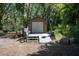 Wooden outbuilding featuring a ramp and a deck, located in a wooded area at 530 Heather Ct, Bartow, FL 33830