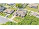 Aerial view of a single-Gathering home with a screened-in pool and well-kept landscaping at 5638 Bloomfield Blvd, Lakeland, FL 33810