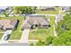 A grey house features an attached garage and manicured lawn at 5638 Bloomfield Blvd, Lakeland, FL 33810