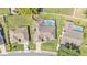 Aerial view of a house with backyard pool and fenced yard at 5638 Bloomfield Blvd, Lakeland, FL 33810