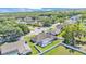 Birds eye view of home with screened in pool, green lawns, and fenced backyard at 5638 Bloomfield Blvd, Lakeland, FL 33810