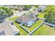 Aerial view of home with a screened-in pool and large fenced backyard at 5638 Bloomfield Blvd, Lakeland, FL 33810