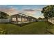 Spacious screened lanai and pool area provide an ideal spot for outdoor living and relaxation on a lush green lawn at 5638 Bloomfield Blvd, Lakeland, FL 33810