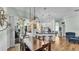 Charming dining area features modern lighting and seamless transition to outdoor living space at 5638 Bloomfield Blvd, Lakeland, FL 33810