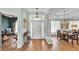 Grand foyer with high ceilings, columns, and elegant lighting fixtures leading to the formal dining room at 5638 Bloomfield Blvd, Lakeland, FL 33810
