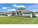 A single-story home is set on a well-kept lawn with manicured shrubbery at 5638 Bloomfield Blvd, Lakeland, FL 33810