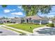 A single-story home with manicured landscaping and a paved driveway at 5638 Bloomfield Blvd, Lakeland, FL 33810