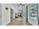 Long hallway leads to the home gym, dining room, and access to the lanai with pool views at 5638 Bloomfield Blvd, Lakeland, FL 33810