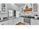 Bright kitchen with stainless steel appliances, white cabinetry, and a window overlooking the pool at 5638 Bloomfield Blvd, Lakeland, FL 33810