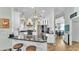 Modern kitchen with white cabinets, stainless steel appliances, and dark granite countertops at 5638 Bloomfield Blvd, Lakeland, FL 33810