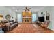 Comfortable living area with brick fireplace, ceiling fan, and open design for modern living at 5638 Bloomfield Blvd, Lakeland, FL 33810