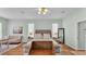 Bright main bedroom offers hardwood floors, neutral walls, and comfortable furniture at 5638 Bloomfield Blvd, Lakeland, FL 33810