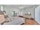 Spacious main bedroom with hardwood floors, dual dressers, and neutral decor at 5638 Bloomfield Blvd, Lakeland, FL 33810