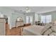 A spacious main bedroom with hardwood floors, slider access to a patio, and a desk area at 5638 Bloomfield Blvd, Lakeland, FL 33810