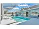 Sparkling screened-in pool and spa area with ample deck space for entertaining at 5638 Bloomfield Blvd, Lakeland, FL 33810