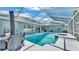 A crystal-clear pool and hot tub are fully screened in for year-round enjoyment at 5638 Bloomfield Blvd, Lakeland, FL 33810