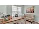 Bright sitting room with hardwood floors, lots of natural light, and neutral decor at 5638 Bloomfield Blvd, Lakeland, FL 33810