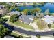Aerial view of a beautiful home on a cul-de-sac with a lake view at 5789 Lake Victoria Dr, Lakeland, FL 33813