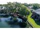 Waterfront home with a large deck and fenced in yard, offering scenic views of the lake at 5789 Lake Victoria Dr, Lakeland, FL 33813