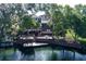 Backyard features multiple decks, a screened in porch, and views of the peaceful lake at 5789 Lake Victoria Dr, Lakeland, FL 33813