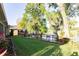 Grassy backyard with wooden deck and a view of the lake at 5789 Lake Victoria Dr, Lakeland, FL 33813