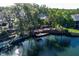 Lakefront property featuring a multi-tiered deck, perfect for entertaining and enjoying the water views at 5789 Lake Victoria Dr, Lakeland, FL 33813
