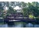 Waterfront home with a multi-level deck, a screened in porch, and private access to the tranquil lake at 5789 Lake Victoria Dr, Lakeland, FL 33813