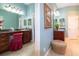 This bathroom features a vanity, granite countertop, and a large mirror at 5789 Lake Victoria Dr, Lakeland, FL 33813