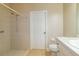 Bright bathroom featuring a shower, toilet, and sink with vanity at 5789 Lake Victoria Dr, Lakeland, FL 33813
