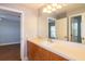 Bathroom featuring wood vanity and double door access to other rooms at 5789 Lake Victoria Dr, Lakeland, FL 33813