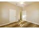 Bedroom featuring neutral walls, ceiling fan, carpet and two closets at 5789 Lake Victoria Dr, Lakeland, FL 33813