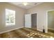 Bedroom with a ceiling fan, animal print carpet, and en suite bathroom at 5789 Lake Victoria Dr, Lakeland, FL 33813