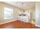 Bright dining area with breakfast bar and adjacent kitchen featuring white cabinetry at 5789 Lake Victoria Dr, Lakeland, FL 33813