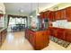 Kitchen with a center island, stainless steel appliances, and adjacent dining area at 5789 Lake Victoria Dr, Lakeland, FL 33813