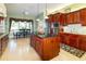 View of the kitchen with wood cabinets, stainless steel appliances, and a center island at 5789 Lake Victoria Dr, Lakeland, FL 33813